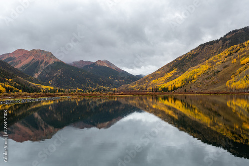 Colorado mountains reflecting on lake 