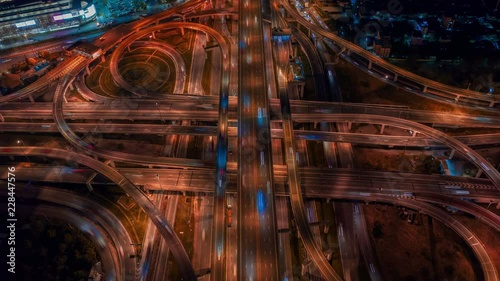 Aerial Hyperlapse of Traffic over big intersection bridges and ring road. 4K aerial view by a drone over big roundabout in Bangkok Thailand.