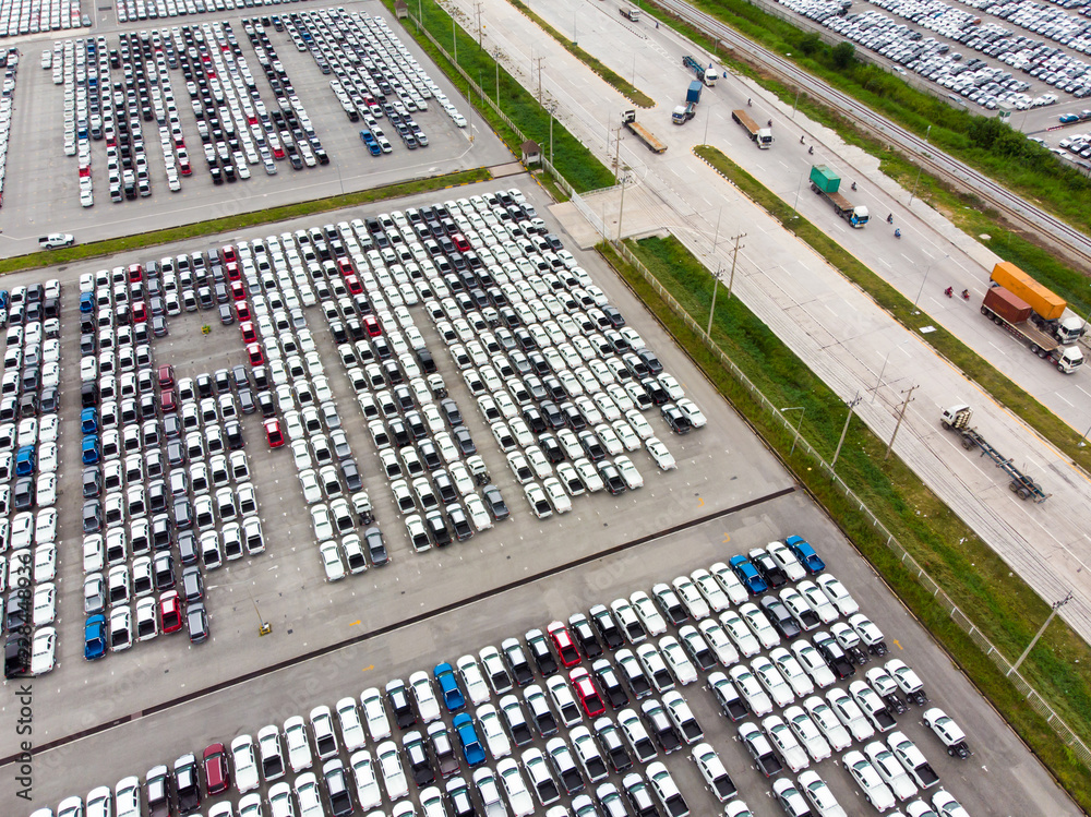 Aerial top view photo from flying drone, New Cars produced Several times a year at industrial estate for import export around in the world