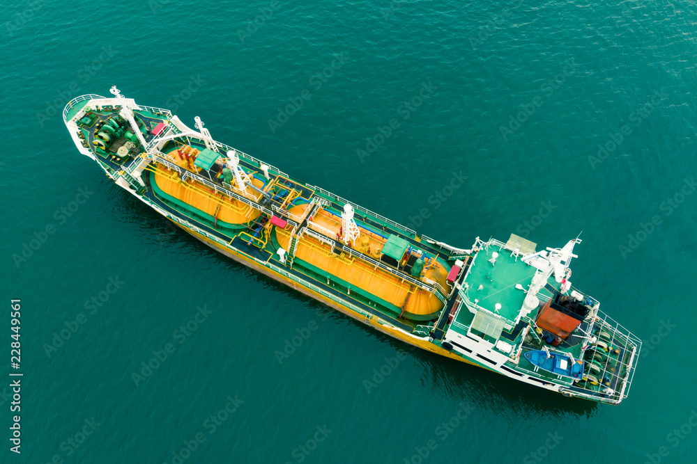 Aerial Top View of sea freight, Crude oil tanker lpg ngv at industrial estate Thailand / Crude Oil tanker to Port of Singapore - import export around in the world