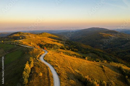 Aerial view of winding road at autumn photo
