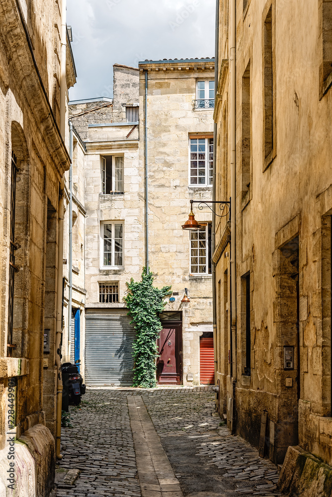 Narrow street in historic city centre of Bordeaux