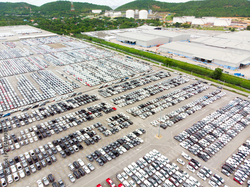 Aerial top view photo from flying drone, New Cars produced Several times a year at industrial estate for import export around in the world