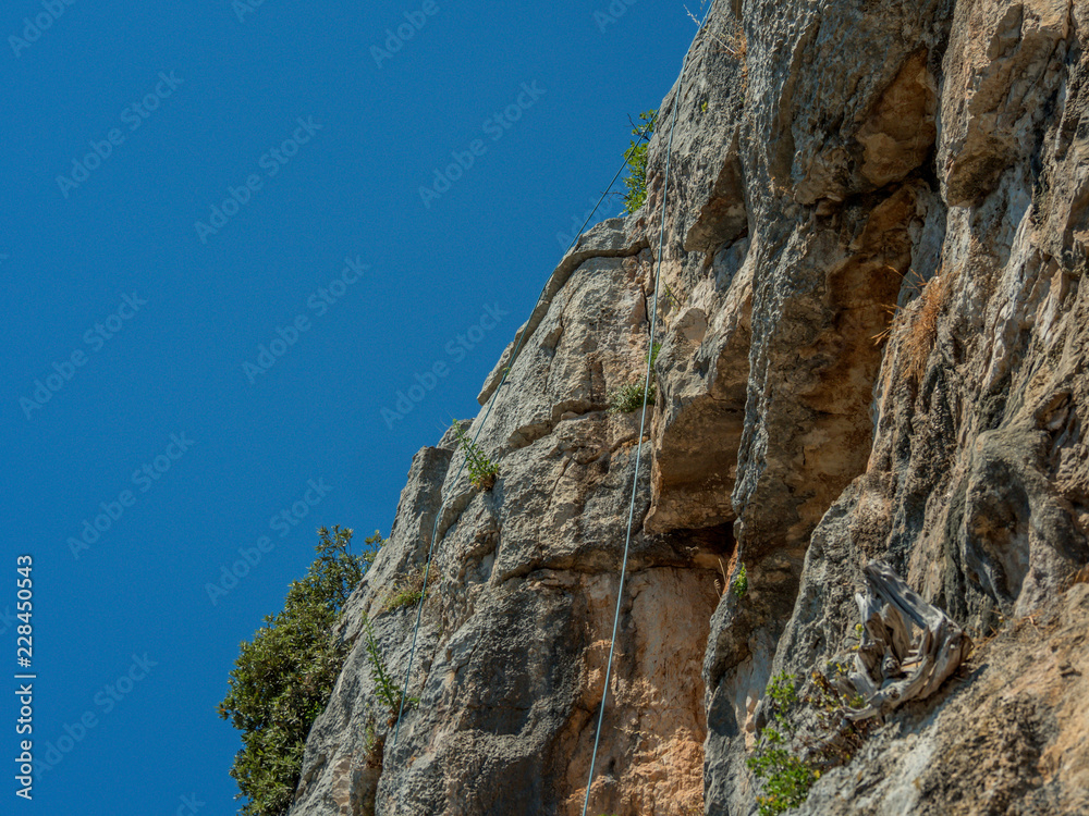 Closeup of natural climbing wall at hills of island Pasman in Croatia. Closeup of natural climbing wall at hills of island Pasman in Croatia.