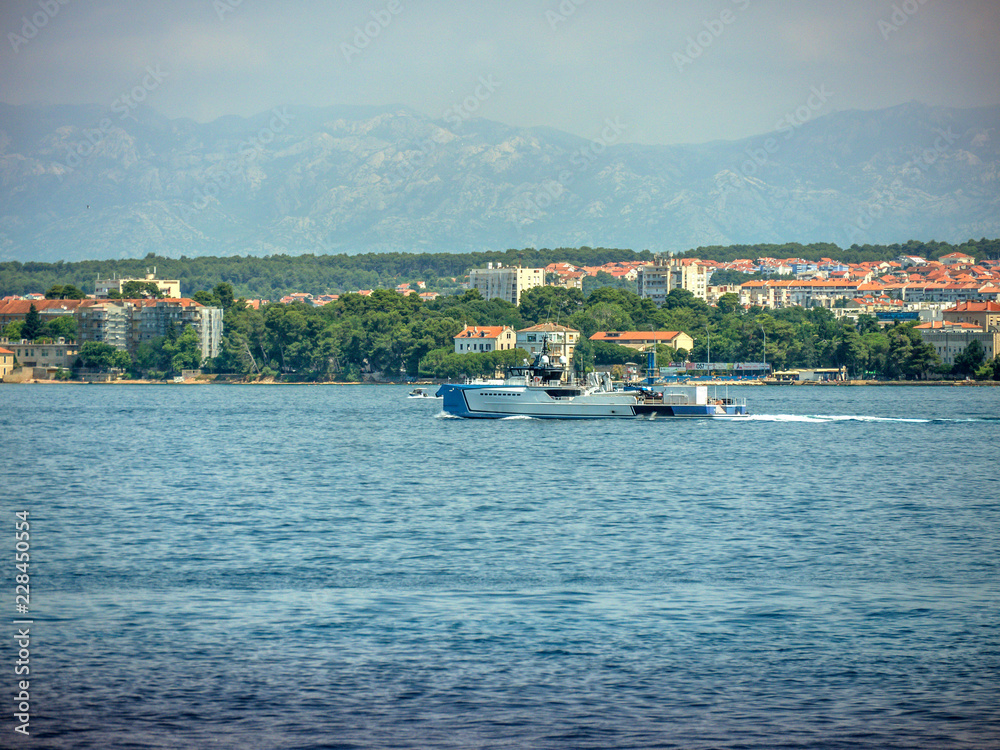 Big boat passing in front of city Zadar in Croatia.
