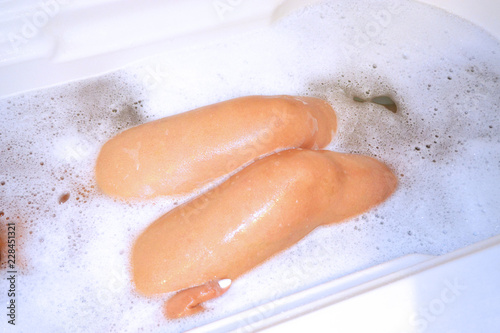 Woman body parts in a hot bubble bath