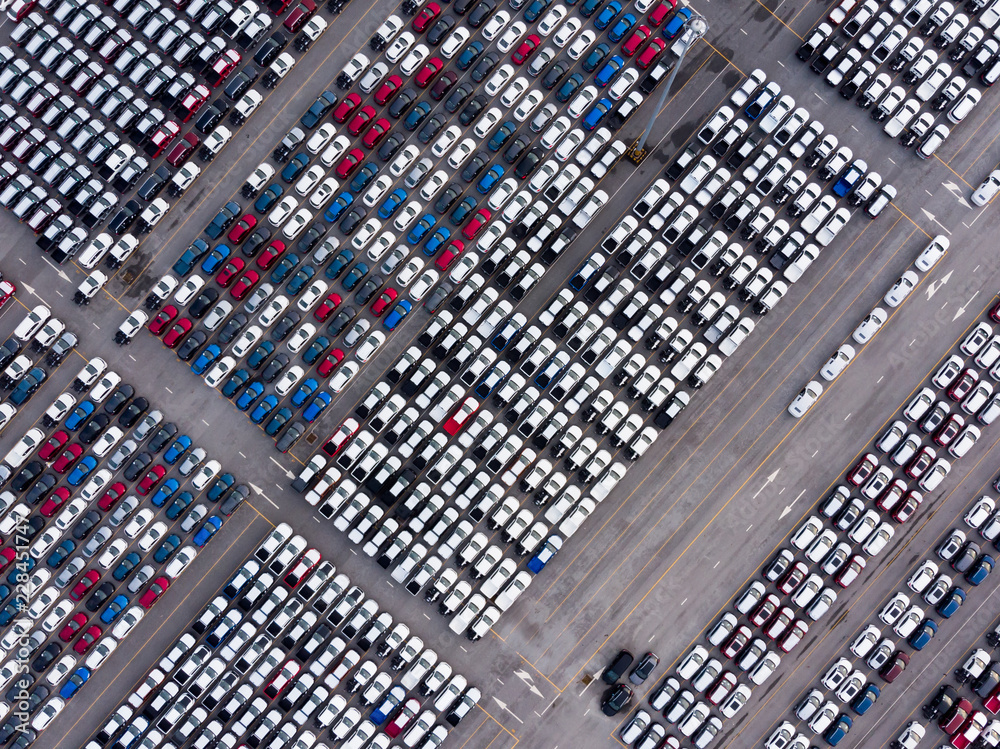 Aerial top view photo from flying drone, New Cars produced Several times a year at industrial estate for import export around in the world Aerial top view photo from flying drone, New Cars produced Several times a year at industrial estate for import export around in the world