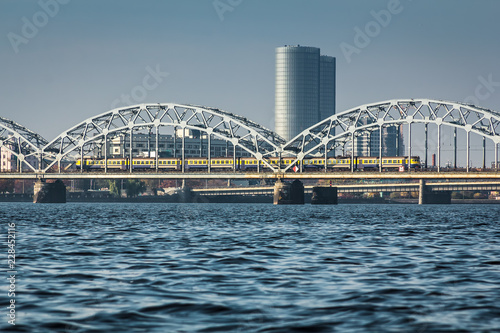 Railway bridge in Riga over the Daugava River in the fall in October on a sunny day © jteivans