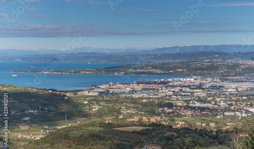 Autumn landscape with town and port Koper in foreground and Julian Alps in background, Slovenia