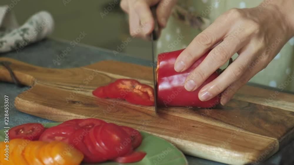 Woman's hands closeup preparing products for pizza and preparing it for baking Woman's hands closeup preparing products for pizza and preparing it for baking