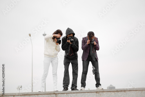 Paparazzi taking capture. People photographers