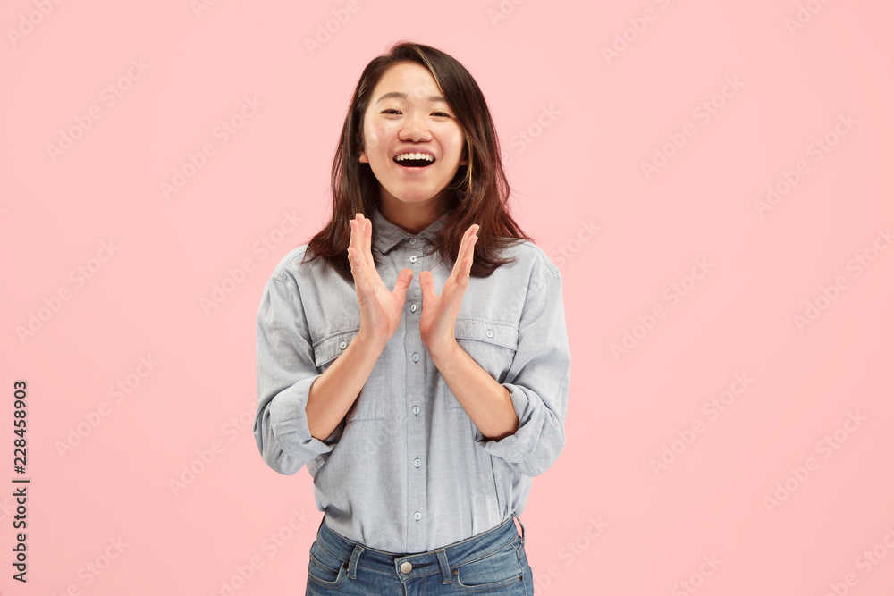 Delight. Beautiful female half-length front portrait isolated on pink studio backgroud. Young, emotional, smiling, surprised woman standing. Human emotions, facial expression concept. Trendy colors Delight. Beautiful female half-length front portrait isolated on pink studio backgroud. Young, emotional, smiling, surprised woman standing. Human emotions, facial expression concept. Trendy colors