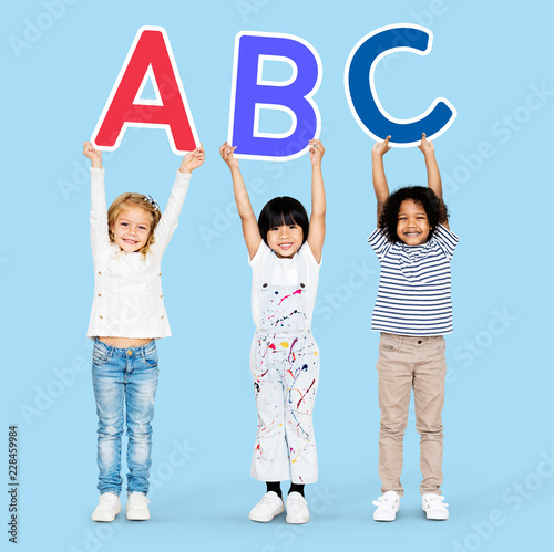 Diverse happy kids learning the ABC