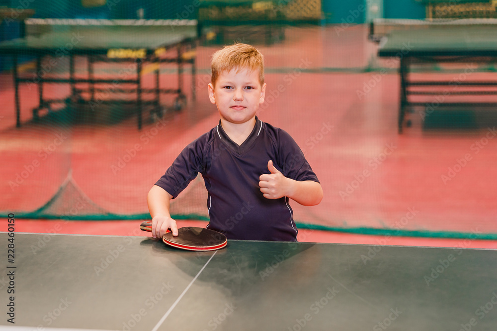 boy table tennis player looks in the camera