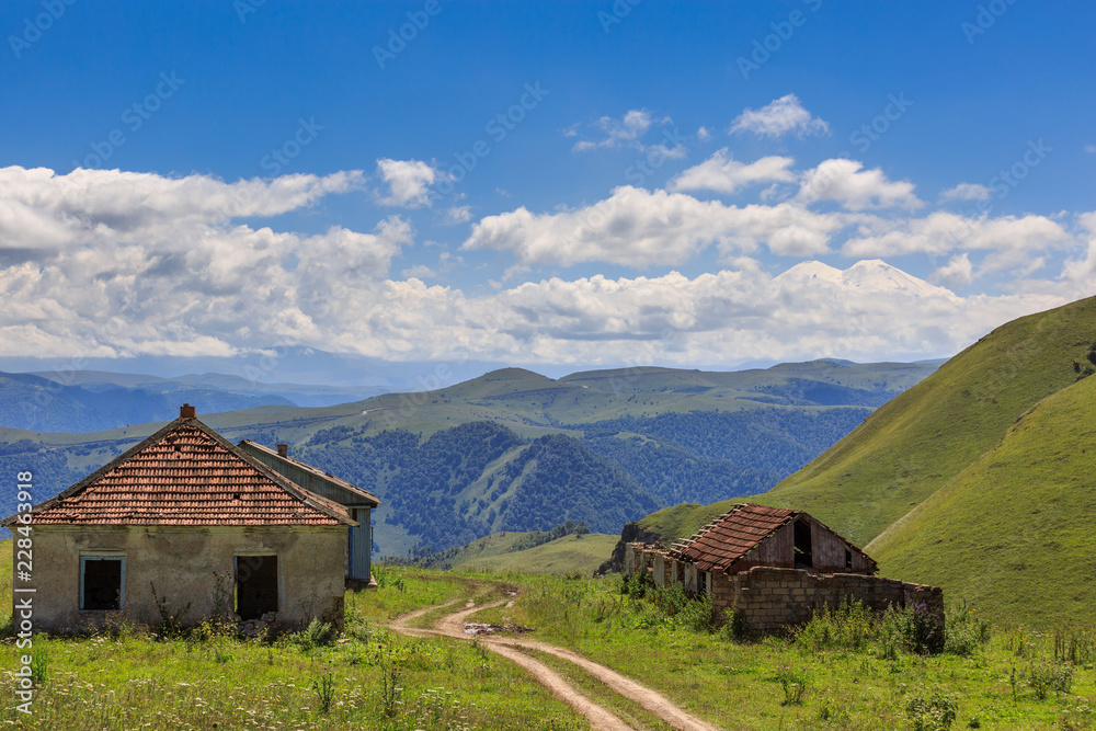 Country road without asphalt in the mountains. Photographed in the Caucasus, Russia.