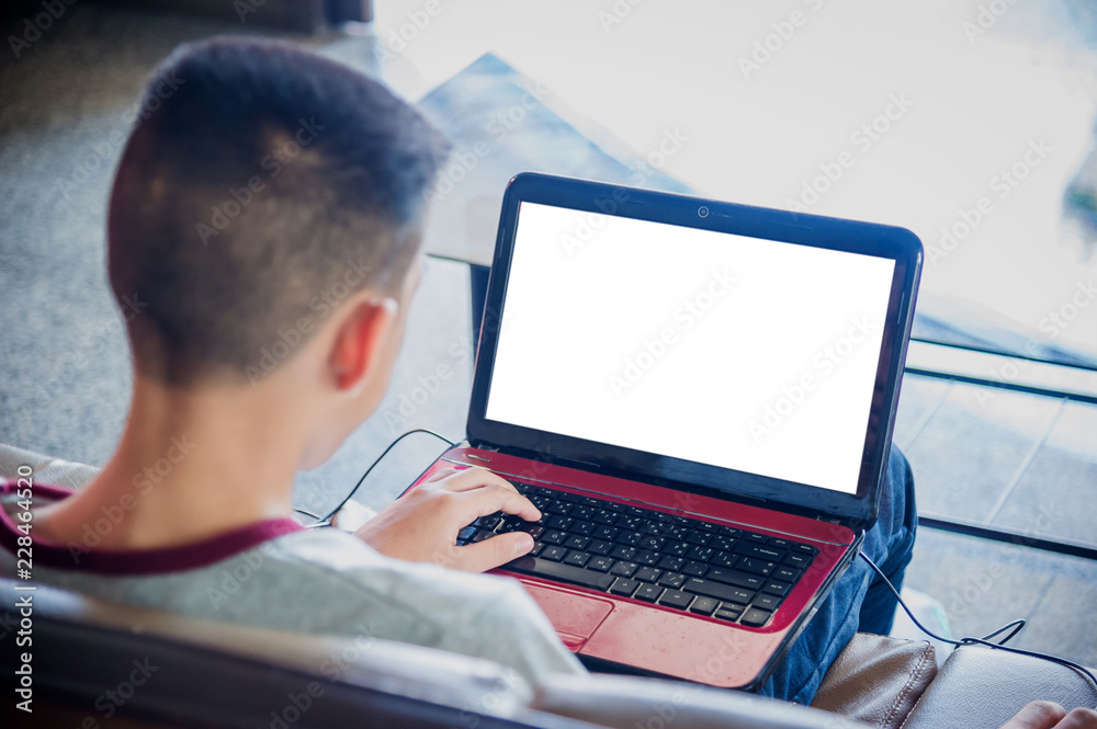 Close-up Of Young Man Working On Laptop At Home Close-up Of Young Man Working On Laptop At Home