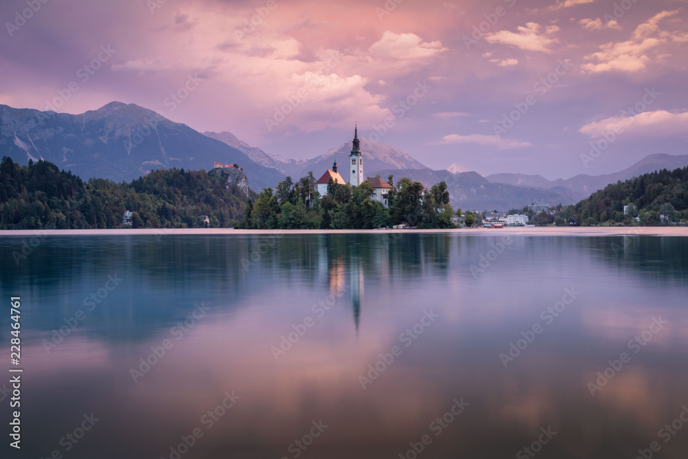 Magical autumn landscape with the island on Lake Bled (Blejsko jezero). Julian Alps, Slovenia, Europe. Attractions. Magical autumn landscape with the island on Lake Bled (Blejsko jezero). Julian Alps, Slovenia, Europe. Attractions.