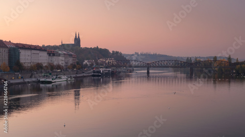 Autumn morning. Misty Vysehrad church and reflection of railway bridge. Prague, Czech republic