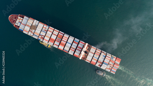 Aerial view or top view of cargo ship, cargo container in warehouse harbor ,shipyard import export logistics concept for background