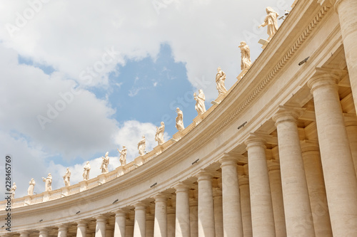 Colonnade crowned by statues. St. Peter's Square. Vatican City. The photo contains enough free space for your other photos or your text. It can be used as a background or template. photo