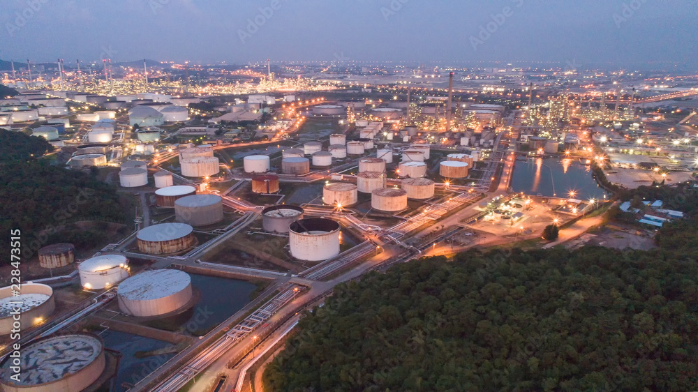 Aerial view gas storage sphere tanks in oil and gas refinery plant during sun rise morning time