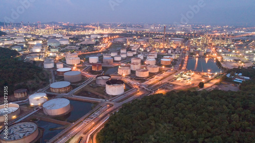 Aerial view gas storage sphere tanks in oil and gas refinery plant during sun rise morning time