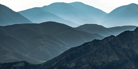 Vast mountain ridge in Ontario California in haze