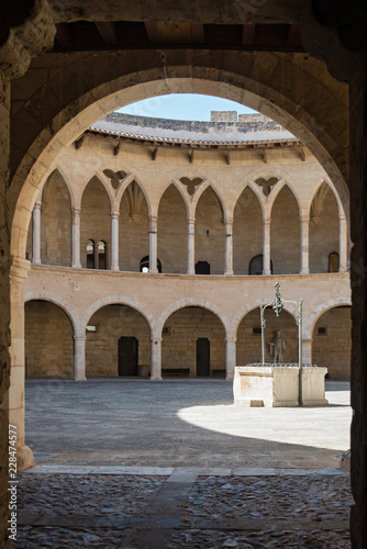 Bellver castle - inner court with well. Medieval fortress in Palma de Mallorca, Balearic Islands, Spain