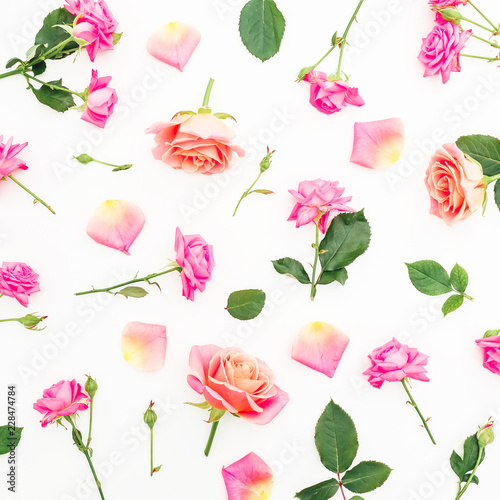 Pattern with pink roses flowers and petals on white background. Flat lay, top view.