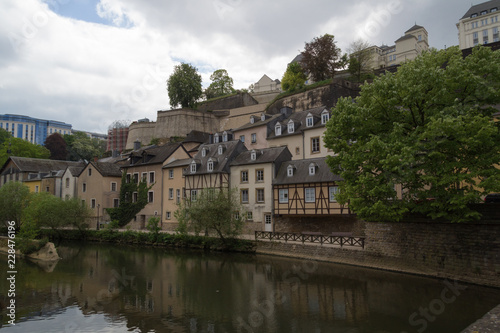 Houses at side of river scene Alzette in Luxembourg from Rue Munster street