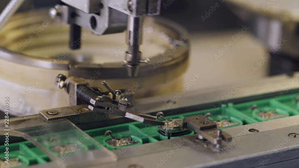 Production of watches, process of assembling the mechanism of a wristwatch machine CNC, gears and parts. Production of watches, process of assembling the mechanism of a wristwatch machine CNC, gears and parts.
