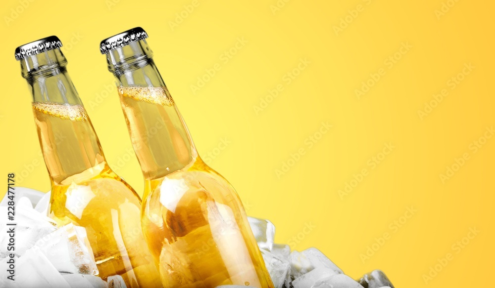 Bottles of cold and fresh beer with ice isolated Bottles of cold and fresh beer with ice isolated