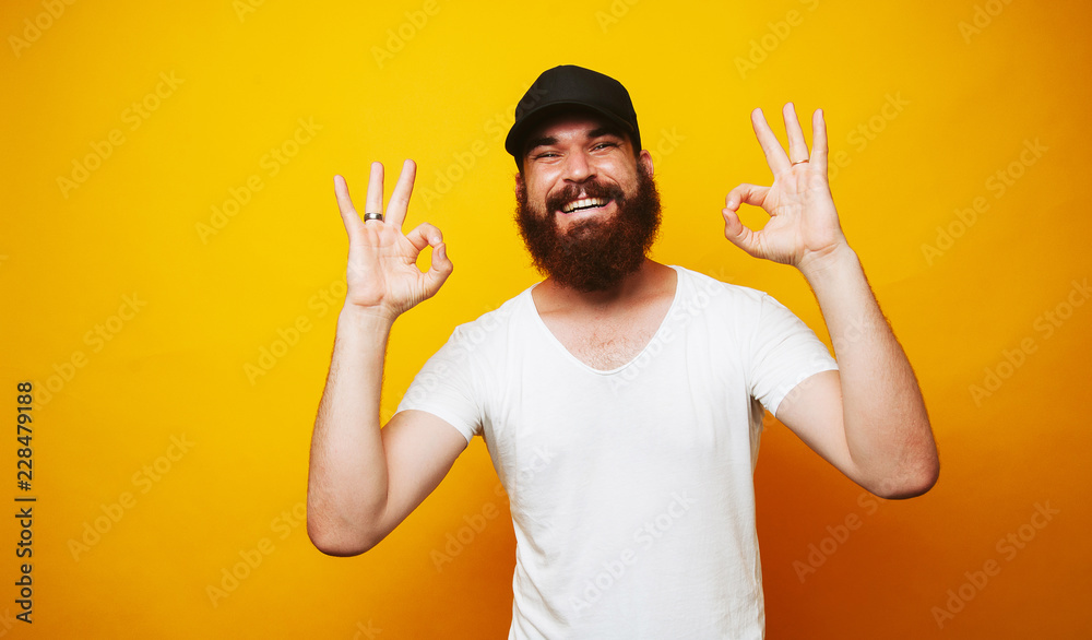 Happy man with beard showing OK gesture Happy man with beard showing OK gesture