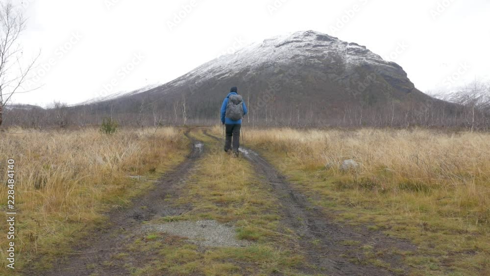 A man travels with a backpack. Hiking adventures. He leads an active and healthy life A man travels with a backpack. Hiking adventures. He leads an active and healthy life