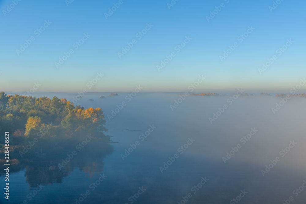 Fog over the water on a river Dnieper on autumn Fog over the water on a river Dnieper on autumn