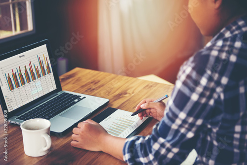 Young Businesswoman with coffee cup is working in office.Creative Team Discussion Corporate Work Concept 