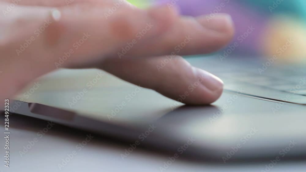 man touching touchpad with fingers close up. selected focus man touching touchpad with fingers close up. selected focus