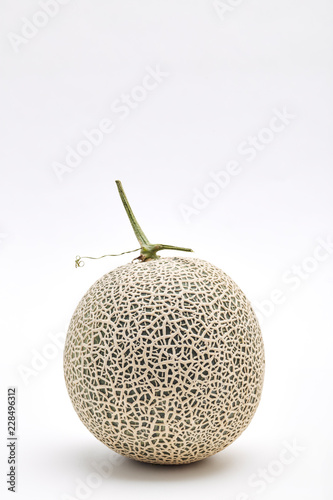 Single cantaloupe melon on white