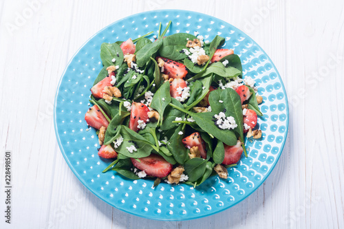 Strawberry salad with spinach , cheese and walnut