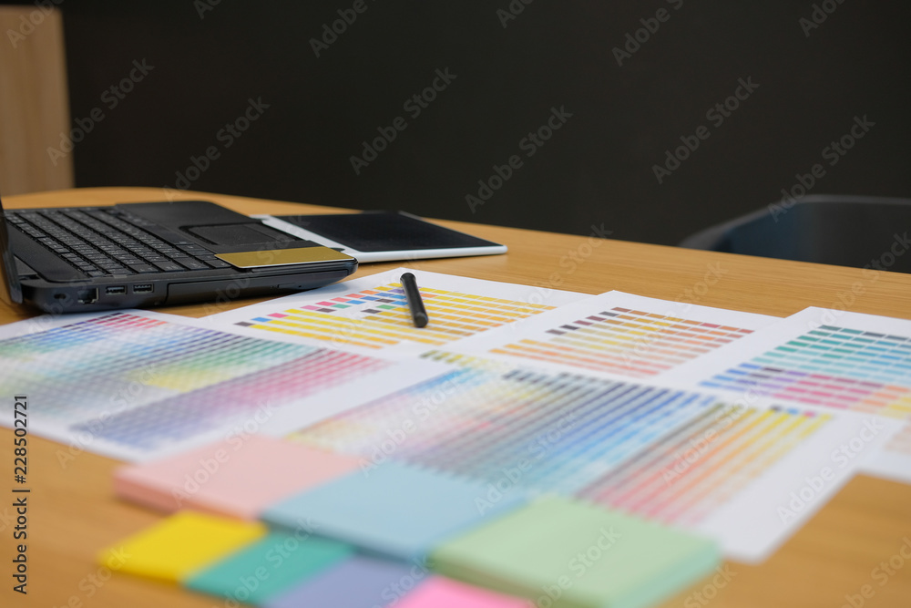 Fototapeta premium color swatch sample catalogue palette guide at graphic designer creative design workplace.