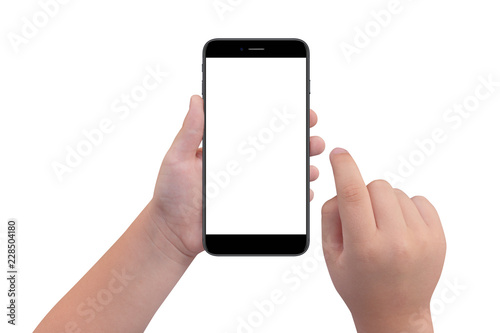 Little boy holding black modern smartphone with empty screen in hand, isolated on white background. Mockup