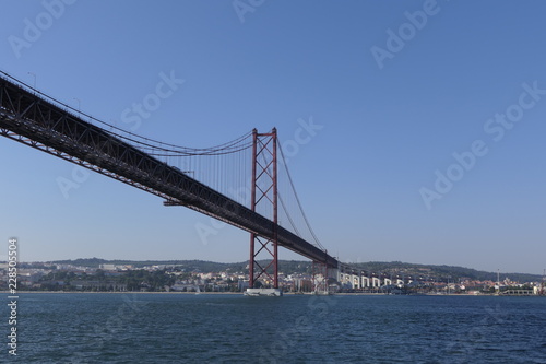 The 25 April bridge (Ponte 25 de Abril) the famous steel suspension bridge located in Lisbon, Portugal
