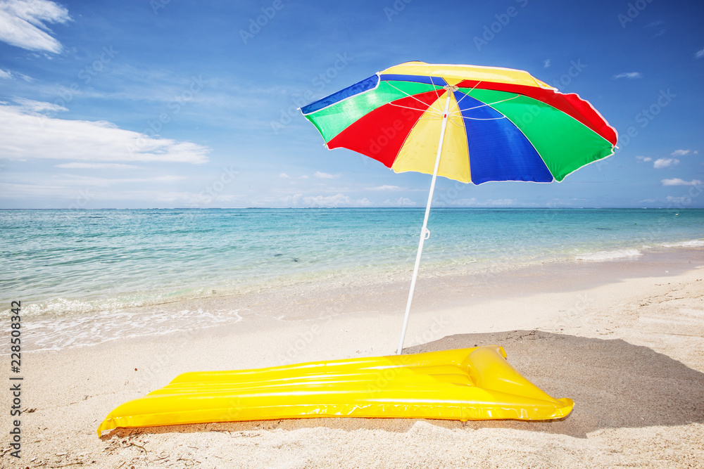 sunshade and air mattress at a beach