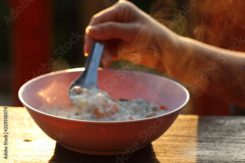 The steam from the shrimp porridge.