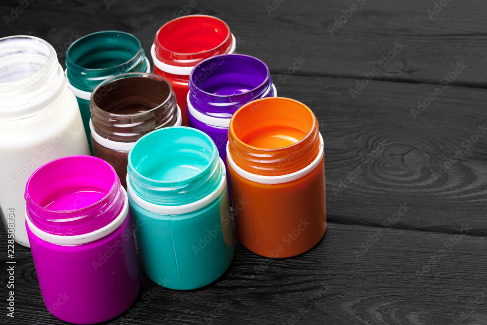 paint bottels on rustic wooden background paint bottels on rustic wooden background