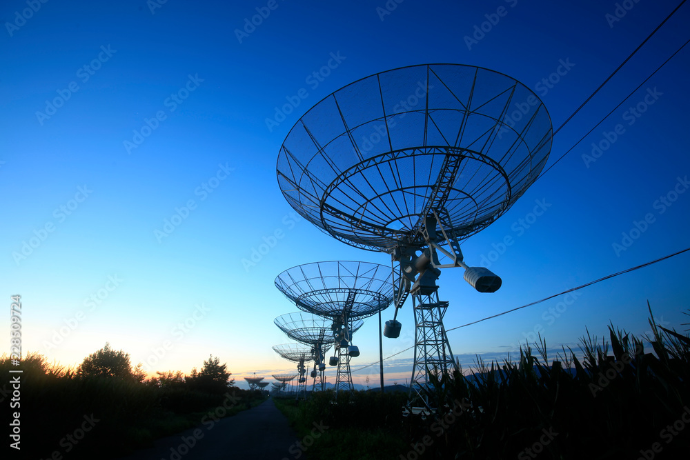The silhouette of a radio telescope The silhouette of a radio telescope