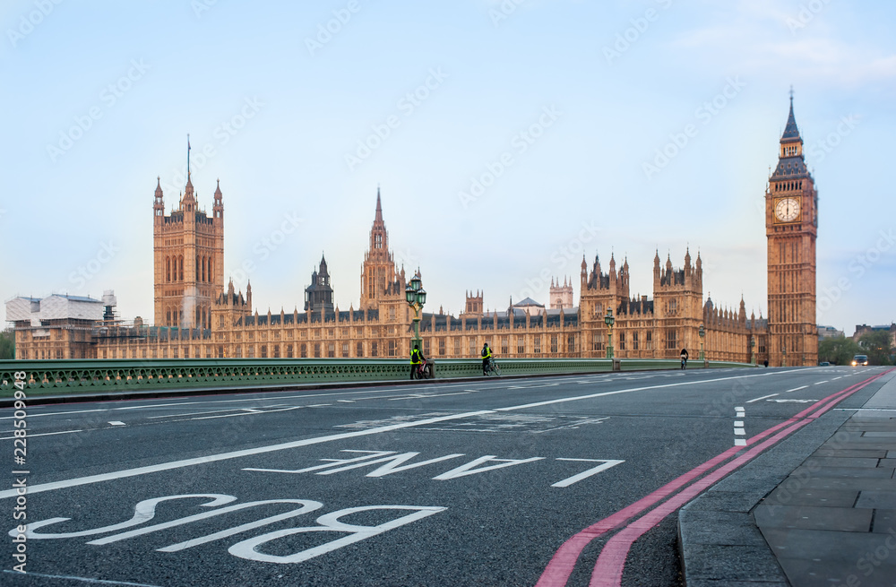 Bus Lane on Westminster Bridge - London, UK - Houses of Parliament and Big Ben tower at dawn. Covid 19 Coronavirus lockdown