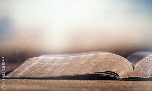 Open Holy bible book on background
