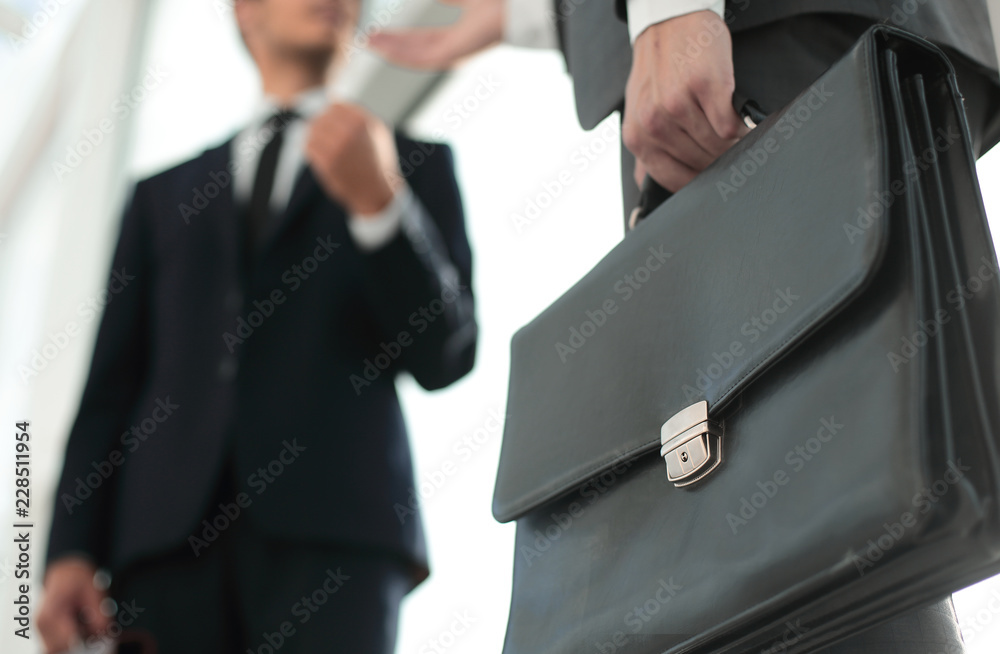 close up.business people on the background of the office window. close up.business people on the background of the office window.