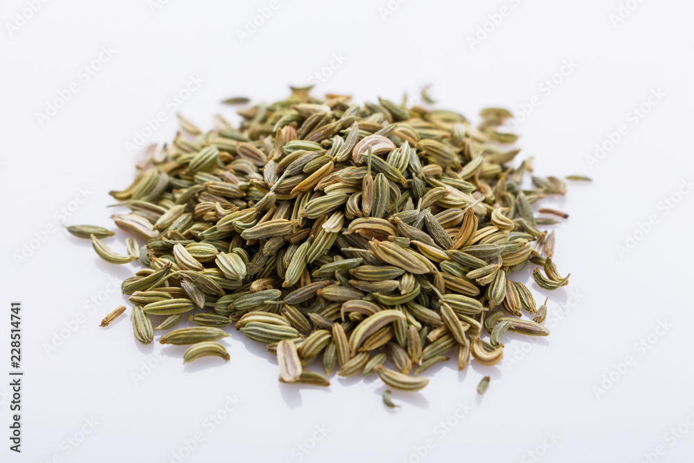 essential oil of fennel seeds on a white background